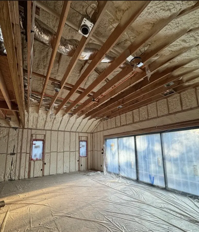 Interior walls and ceiling insulated with spray foam during new construction in Siloam Springs